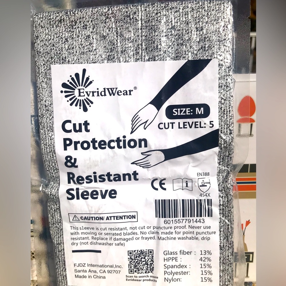 New. Sealed in package. Evrid Wear size M gray cut resistance sleeves, one pair.